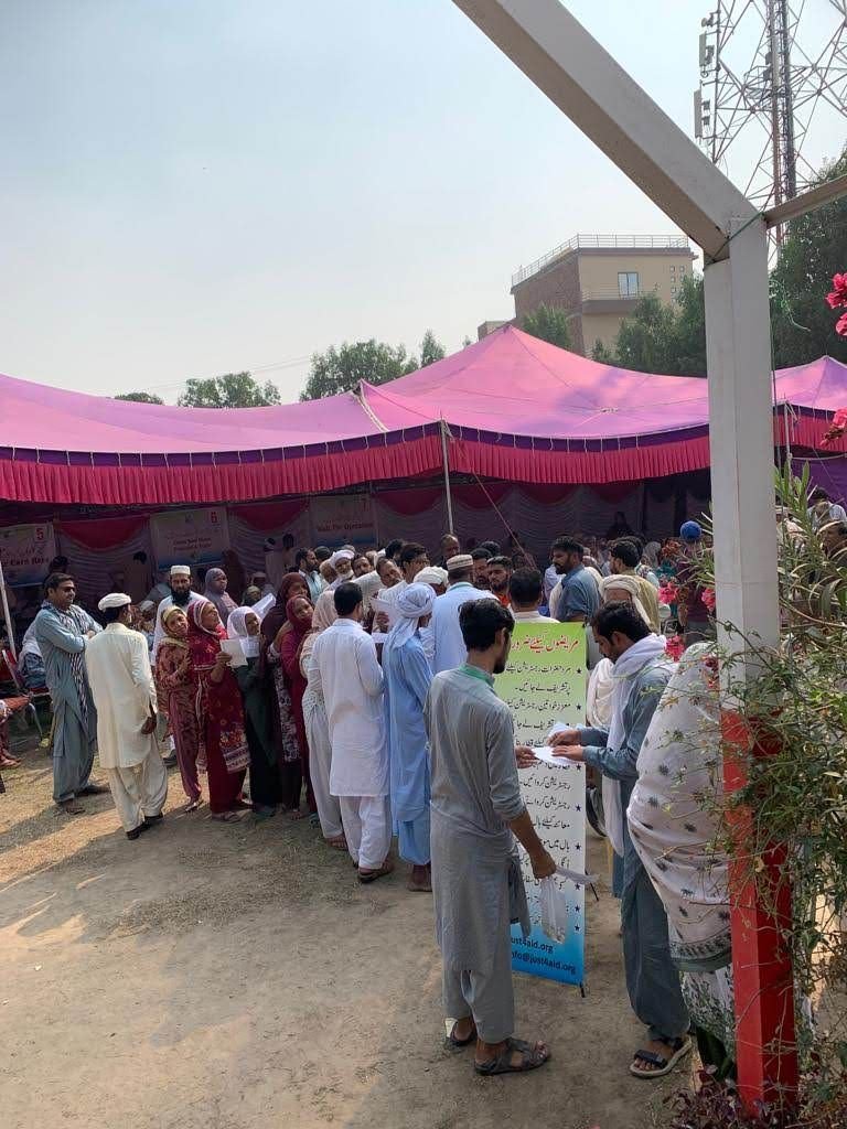 Patients arriving at the camp outside the marquee